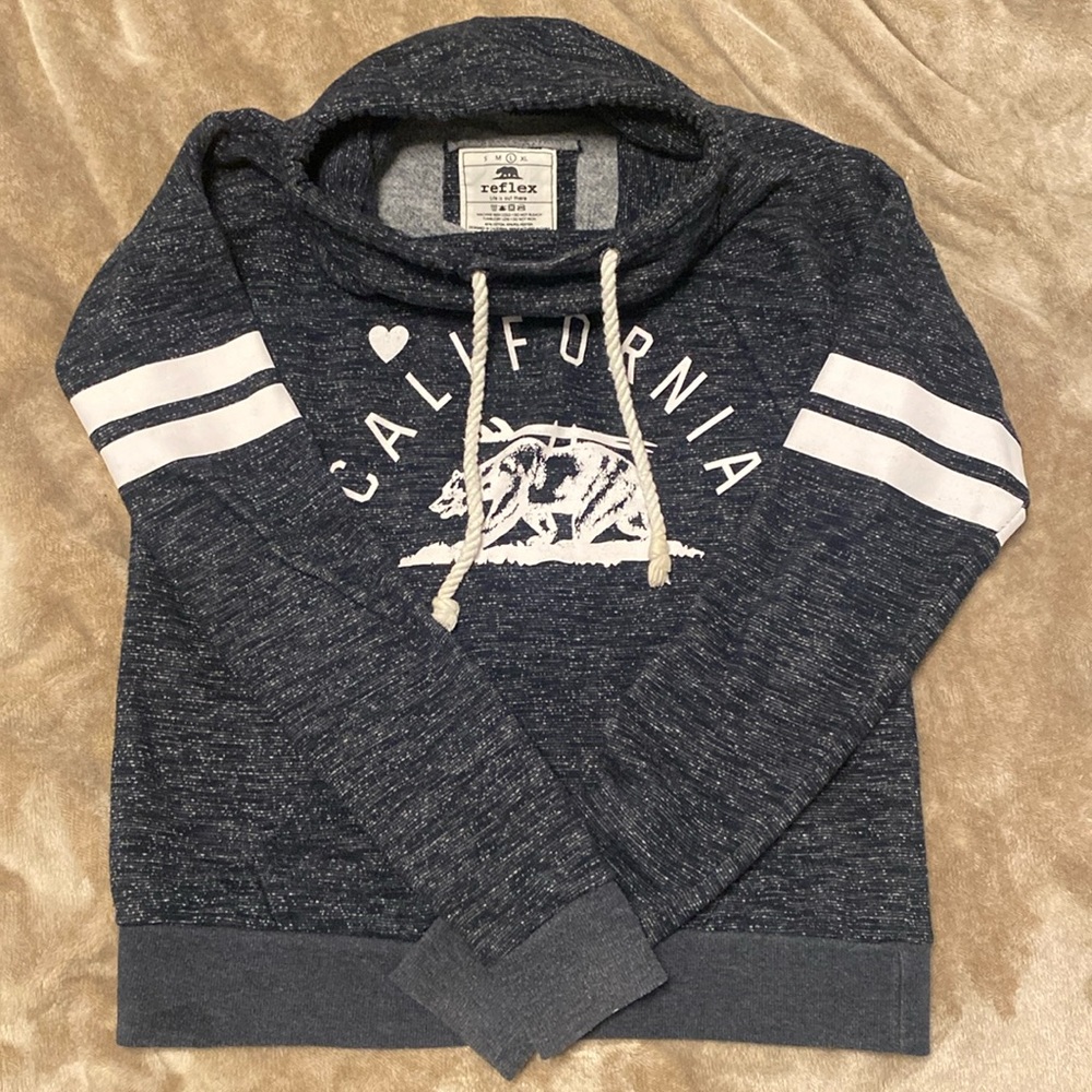 Juniors size large, long sleeve sweatshirt with strings